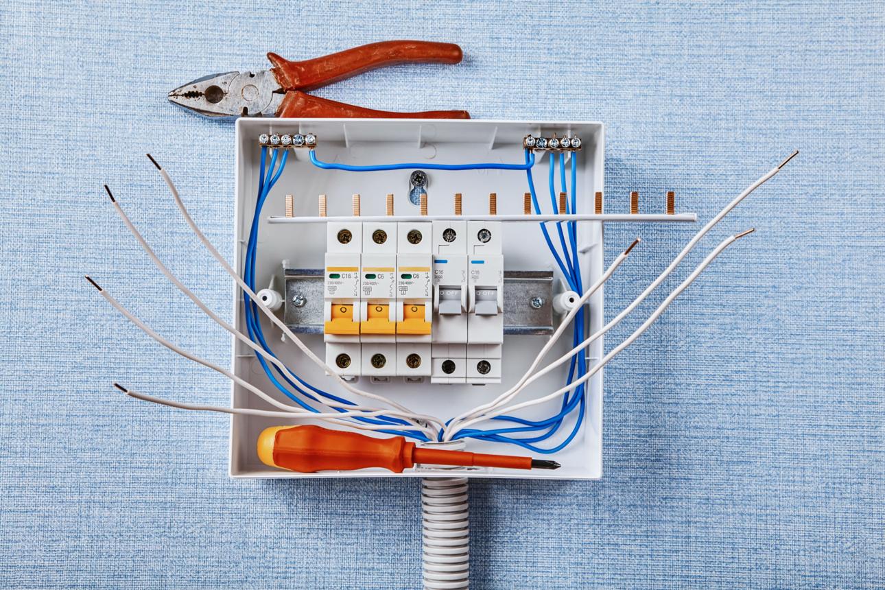 Certified electrician completing safe panel service updates