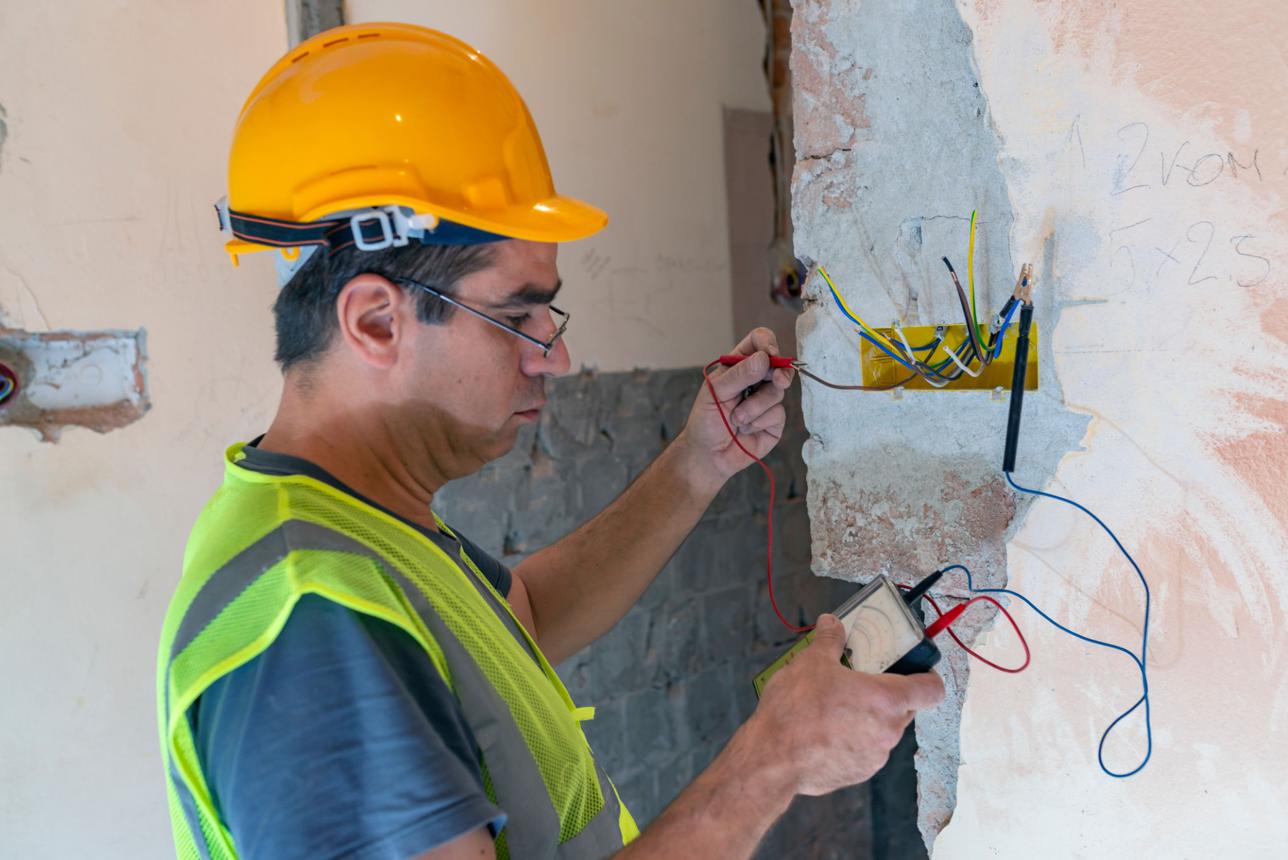 Rapid response emergency service technicians diagnosing structural systems